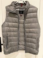 Front view of grey OSC Cross down puffer vest