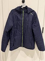 Full view of front showing color, quilt pattern, lime zipper, hood