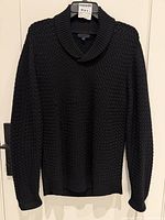 Full front view of navy knit shawl-collar sweater on hanger