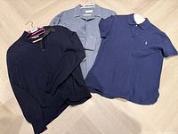 Group shot of three garments: Canali sweater, Officine Générale shirt, Polo Ralph Lauren polo