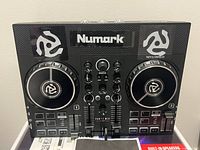 Front view of Numark Party Mix Live controller with manual visible
