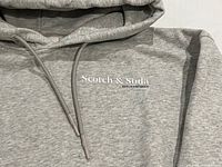 Front chest area showing Scotch & Soda logo and drawstring hood