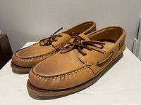 Oblique view of both shoes showing uppers, lacing and overall condition