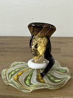 Front view of Murano glass figurine showing full form and colours