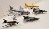 Group of six diecast airplane models displayed on tabletop