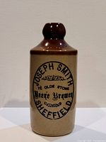 Full front view of bottle showing form and transfer graphics