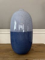 Full view of two-tone blue Sporvil vase on table