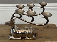 Full view of polished steel stag candelabra with six candle cups