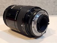 Rear view showing Nikon F mount and aperture coupling