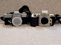 Minolta SR-T 101 and Nikon F60 bodies side by side