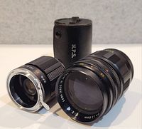 Lens, tele converter and case grouped