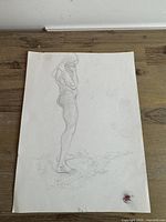 Full view of the 9 x 12 in graphite figure sketch on paper with wax stamp