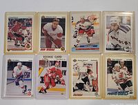 Front view of eight sleeved hockey cards