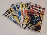 Group of eight bagged Indiana Jones comics fanned out