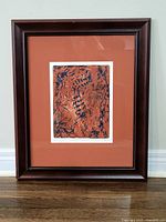 Full view of framed serigraph with mat