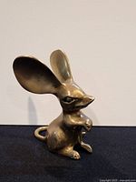 Front right view of solid brass mouse figurine