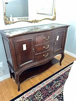 Front view of American Drew buffet showing drawers, cabinets, stone top