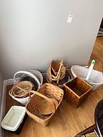 Group of assorted baskets on floor