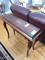 Console table front angle showing top inlay and legs