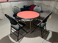 Full view of card table and four chairs