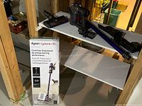 Vacuum components on shelf with box