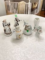 Group shot of five porcelain items on table