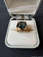 Ring in open box, front view