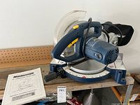 Full view of Mastercraft 10" compound mitre saw with manual on table