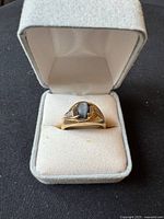 Ring in open presentation box, frontal view