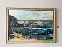 Full view of framed oil painting depicting seascape