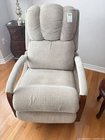 Front view of beige upholstered manual recliner chair