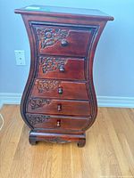 full view of bombe chest showing all five drawers and curved sides