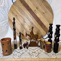 Group shot of all nine carved and ceramic pieces