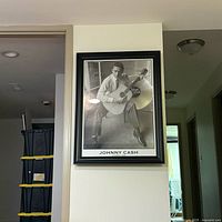 Full view of framed Johnny Cash wall art hung on wall