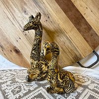 Mother and baby giraffe figurines front view