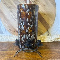 Full view of vase with candleholder in front