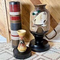 All three vases side by side showing relative sizes and color schemes