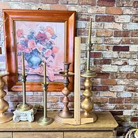 Full lot: framed print and five candlesticks on console