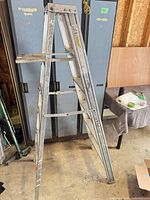Full view of folded aluminum step ladder