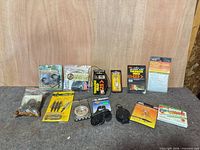 Overall lot view showing all bow-hunting items arranged on table