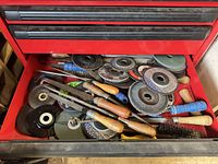 Drawer showing assorted files, abrasive discs and brush