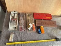 Overview of all cleaning kits and supplies on table