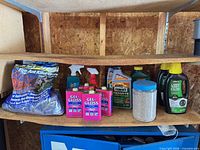 Shelf showing entire lot of garden chemicals
