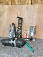 Group shot of boxed decoys, foam decoy, stakes, sleeve, insect repellent