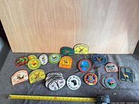 All patches laid out with measuring tape for scale