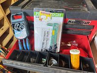 Overview of drawer showing wrench set, riveter kit, magnets, bits, wire wheels, solder