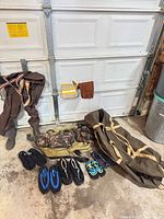 Full lot overview showing bags, waders, water shoes, gloves, strap