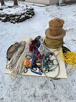 Tabletop view showing all ropes, straps, spools, chain and clamp