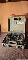 Hammer drill in open grey carry case