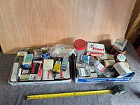 Overall view of two boxes of assorted hardware fasteners